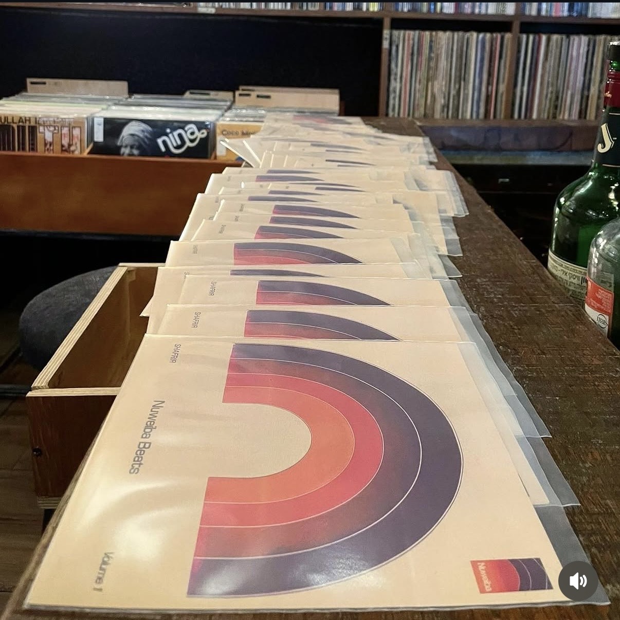 A full run of Nuweiba Beats jackets lined up across a record shop counter