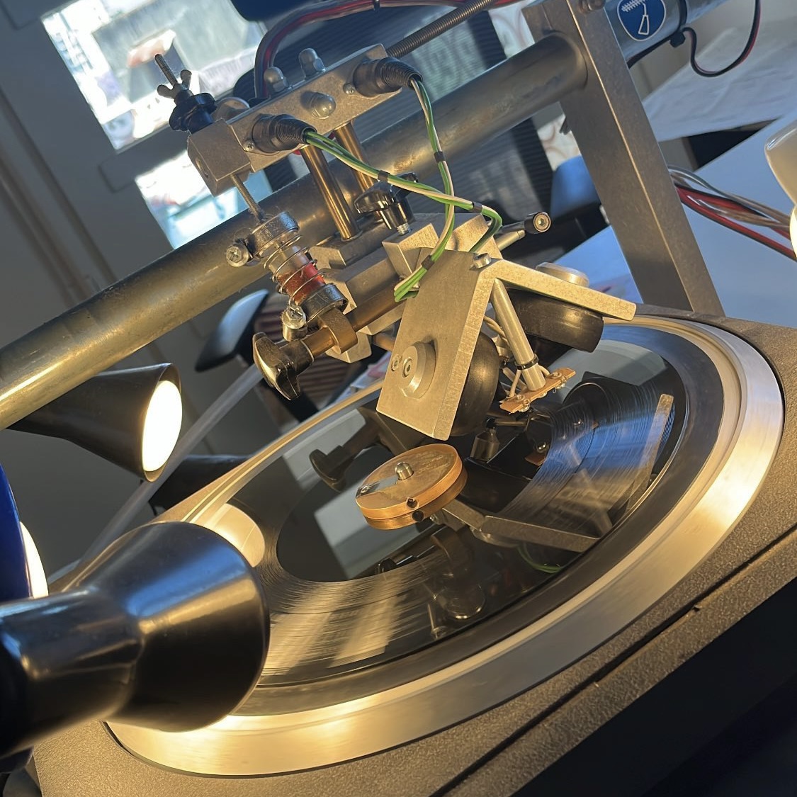 Close-up of the PLASTIK cutting head while lathing a record
